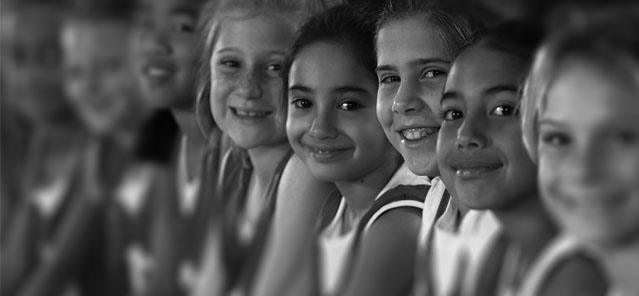 Black and White Image of Young Athletes Smiling Black and White Image of Young Athletes Smiling